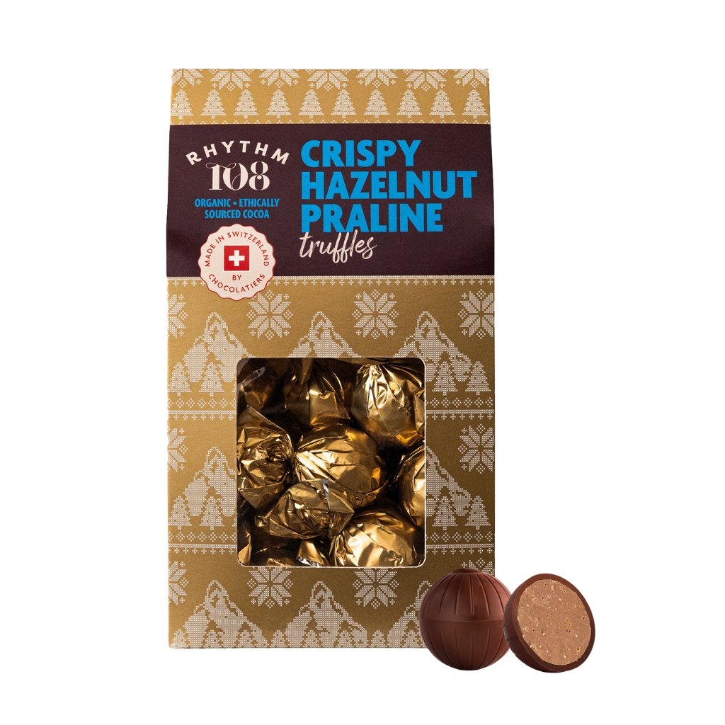 Packaging of Rhythm 108 Crispy Hazelnut Praline truffles with a decorative pattern.