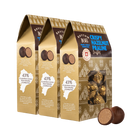 Three boxes of Rhythm Crispy Hazelnut Praline Truffles with a close-up of a box showing the truffles inside.